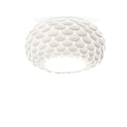Clérachic oval ceiling light with pale overlapping scales and a faint shadow at its top edge, on a white background.