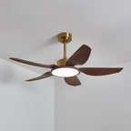 The Clérachic ceiling fan from below with its LED disc lit in a neutral white, against a white ceiling and corner wall.