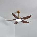 The Clérachic ceiling fan from below with its LED disc lit in a cool white, the blades dark against a pale ceiling.