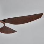 Close view of the long, tapering tip of a walnut-grain blade on this Clérachic ceiling fan.