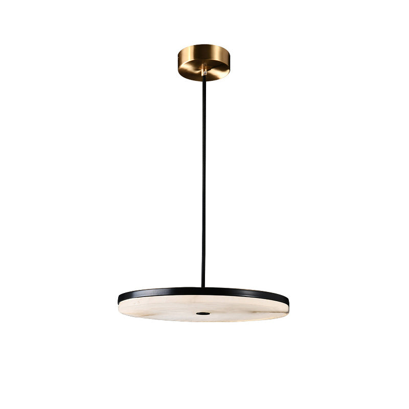 Clérachic Flat Disc Pendant Light straight on against white, the 5 cm (2″) alabaster slab reading as a thin line under its black rim.