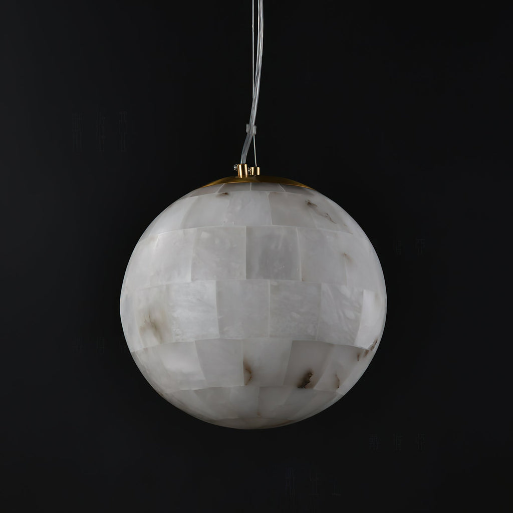 Clérachic alabaster globe on black, the hand-tiled stone panels meeting a slim brass collar at the top.