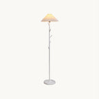 White Clérachic floor lamp with a pleated shade, branch-style pole and marble base, shown on a plain off-white backdrop.