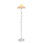 White Clérachic floor lamp, lit, with a pleated shade, three short branch hooks on the pole and a marble base on a white backdrop.