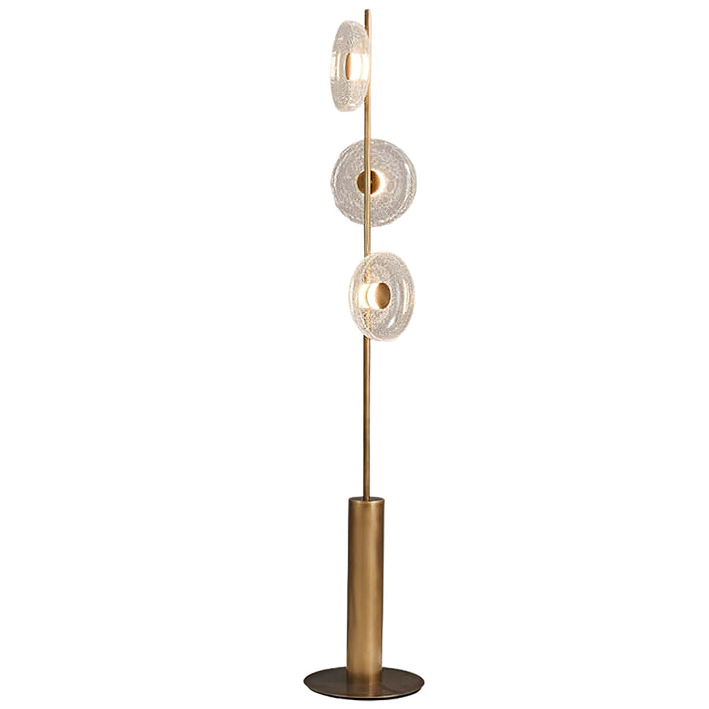 This Clérachic floor lamp on a plain white backdrop, with three clear cracked glass discs, a bronze stem and a round foot.