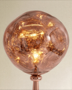 Clérachic close-up of the rippled rose gold shade glowing warm over a polished ball joint and slim cone neck.