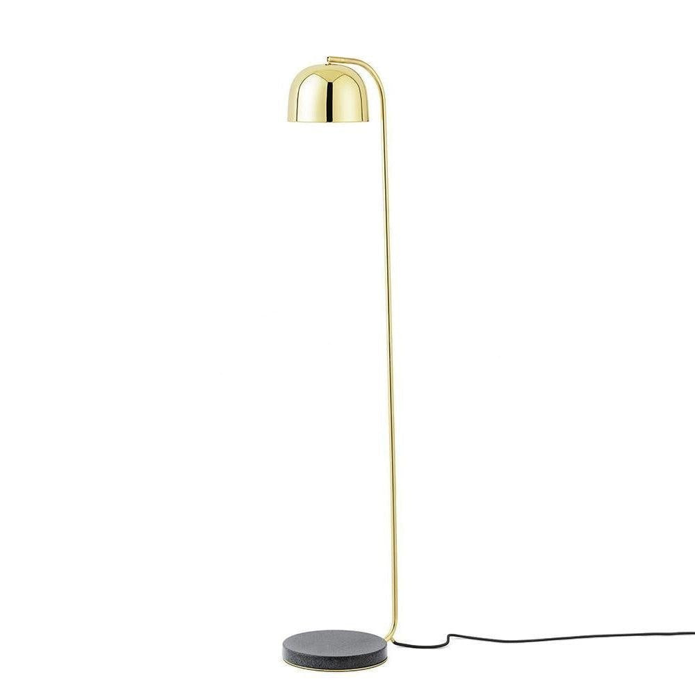 Gold dome-shade floor lamp from Clérachic photographed alone on white, showing its slim pole and marble foot.