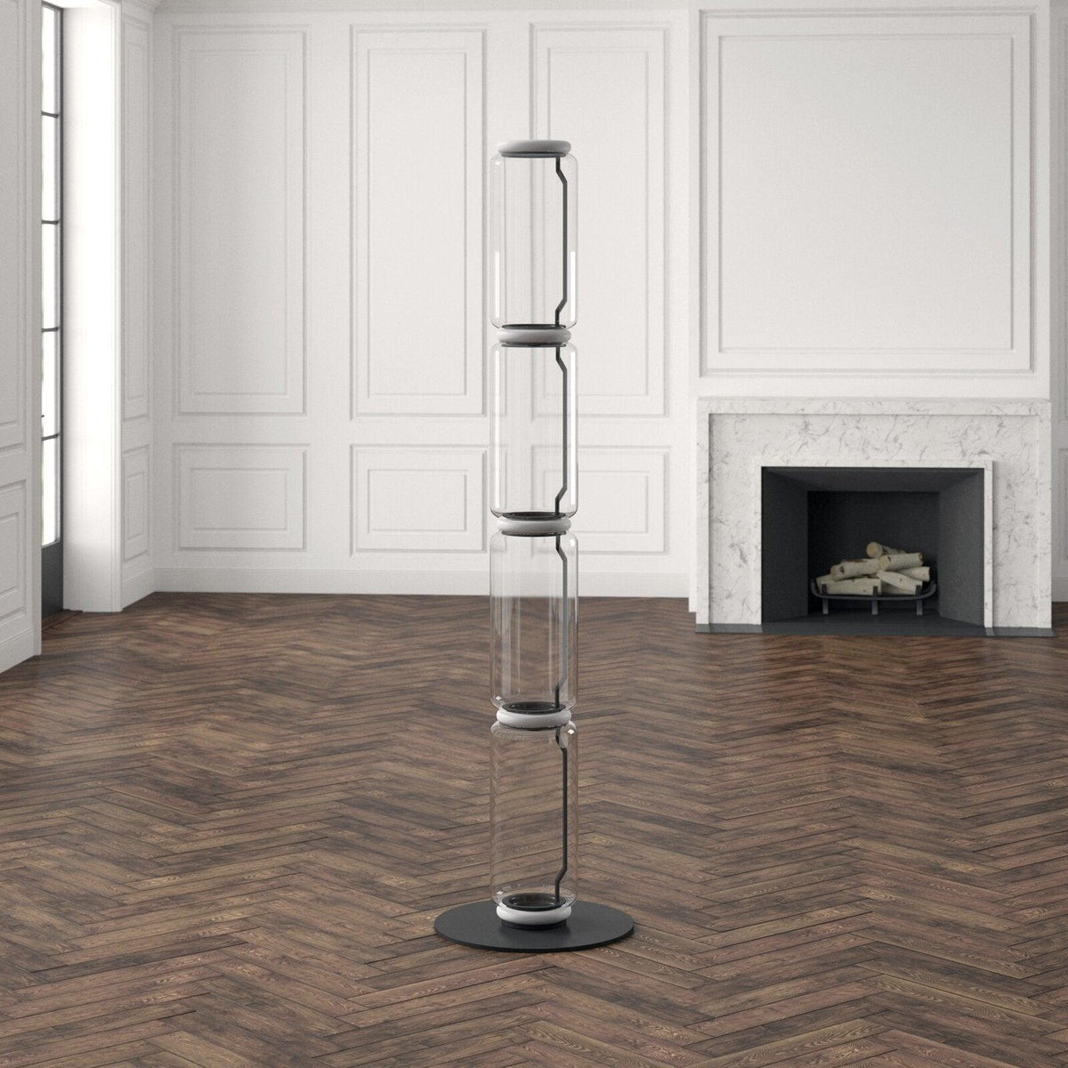 Tall unlit Clérachic glass floor lamp on a herringbone floor in a white panelled room, black connectors showing between the glass sections.