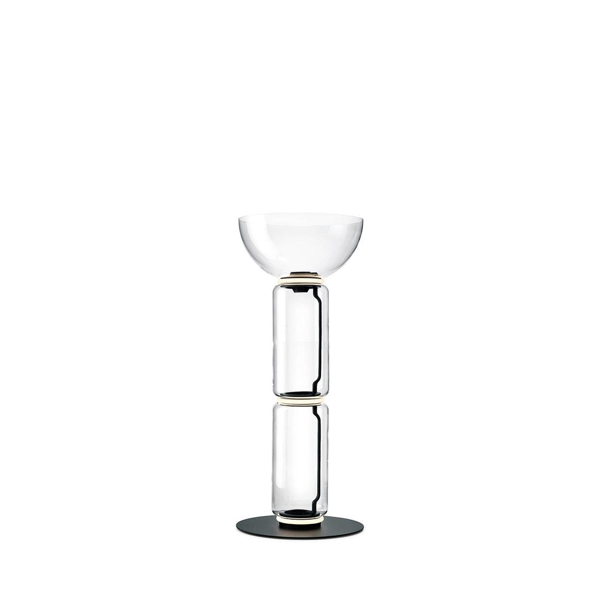 Clérachic glass floor lamp with a bowl shade over two clear cylinders on a round black base, against a plain white backdrop.