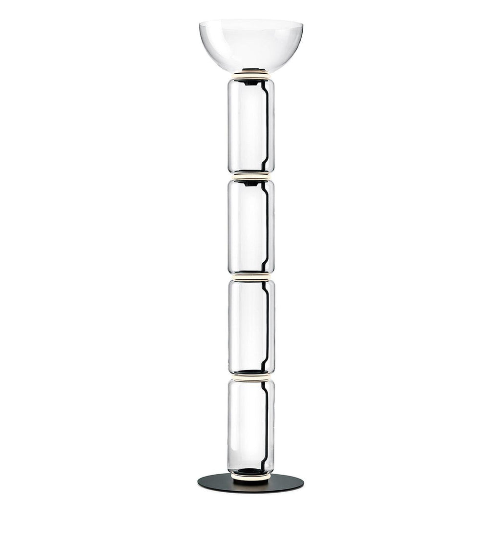 Tallest Clérachic glass floor lamp with a bowl shade over four stacked clear cylinders, on a round black base against white.