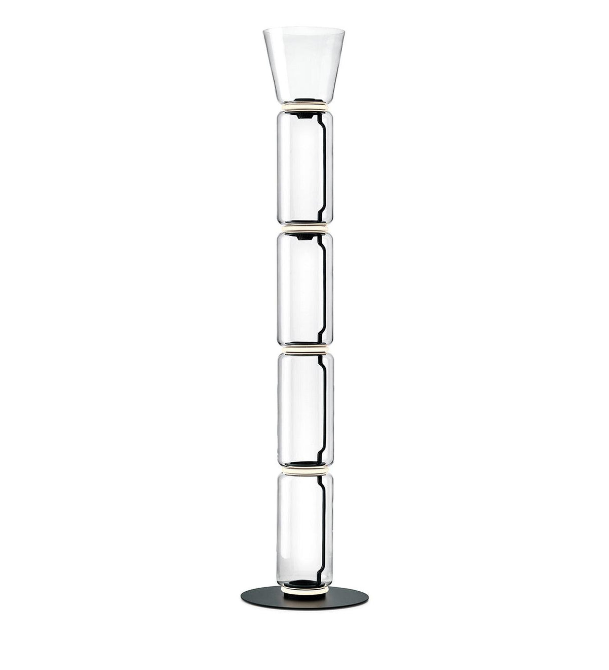 A Clérachic glass floor lamp with a narrow cone shade over four clear cylinders and a black round base, on white.