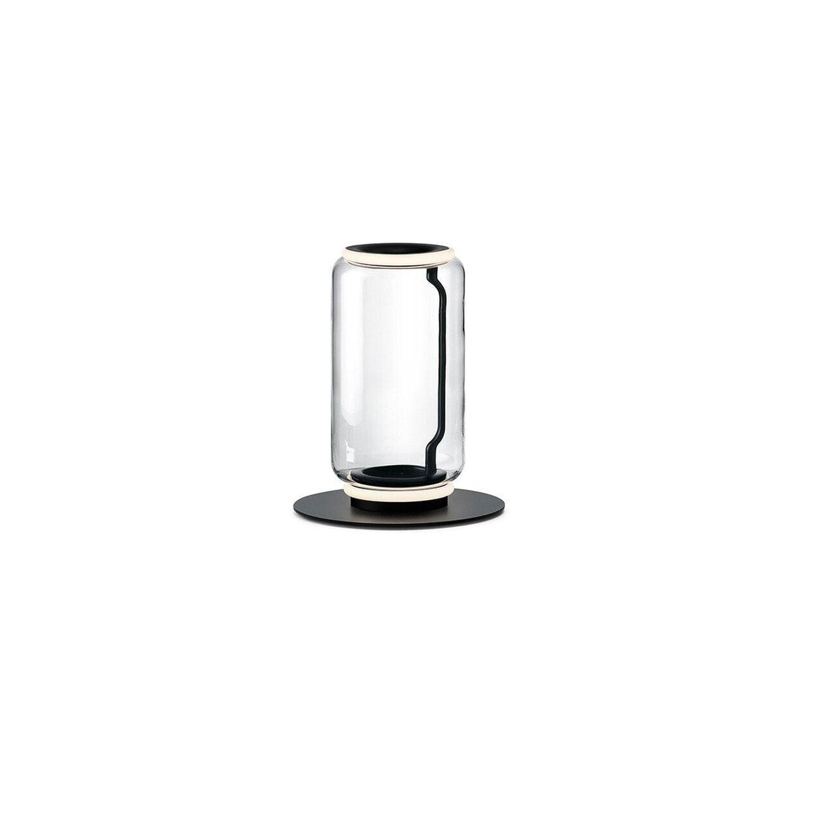 Clérachic table-height glass lamp with one clear cylinder and a lit ring at the top, on a round black base against white.