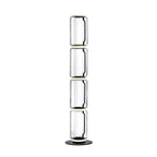 Clérachic glass floor lamp with four stacked clear cylinders and a black cord inside, on a round black base against white.
