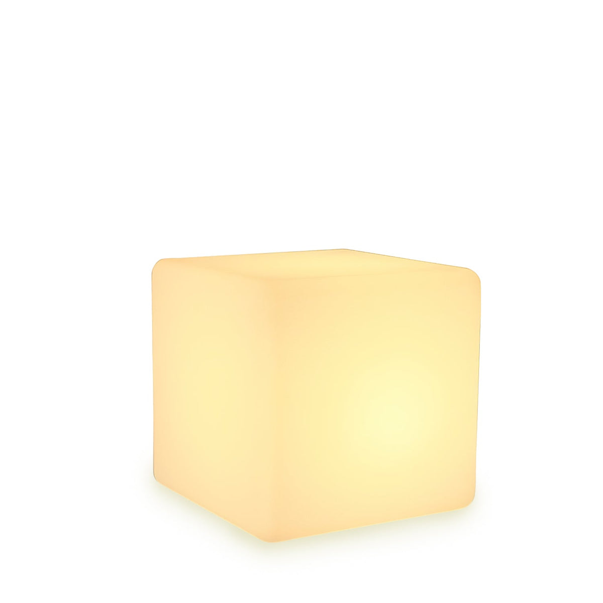 Seen from a slightly higher angle on a white backdrop, this white Clérachic cube lamp glows with a soft warm light.