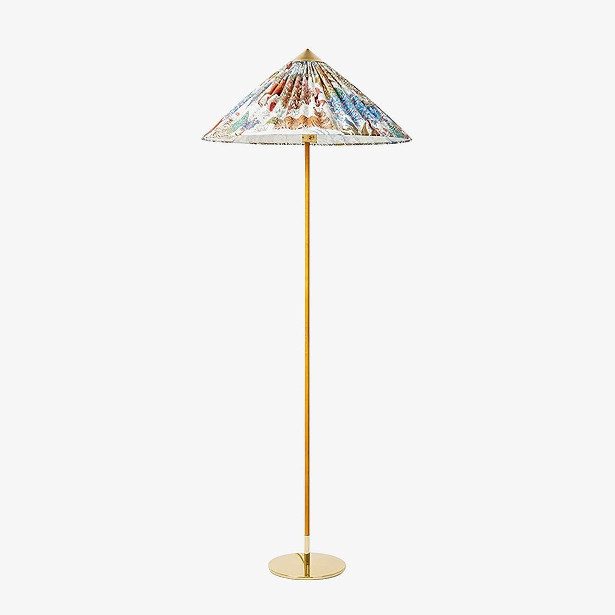 This Clérachic floor lamp on a plain white backdrop, with a wide conical shade printed with a colourful floral pattern on a slim brass stem.