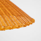 Close view of the open woven rattan weave and the stitched rim on the shade of this Clérachic floor lamp.