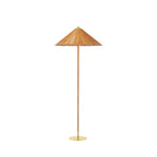 This Clérachic floor lamp with a woven rattan shade and a cane-wrapped stem on a brass base, on a plain white backdrop.