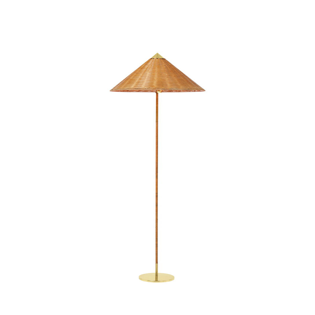 This Clérachic floor lamp with a woven rattan shade and a cane-wrapped stem on a brass base, on a plain white backdrop.
