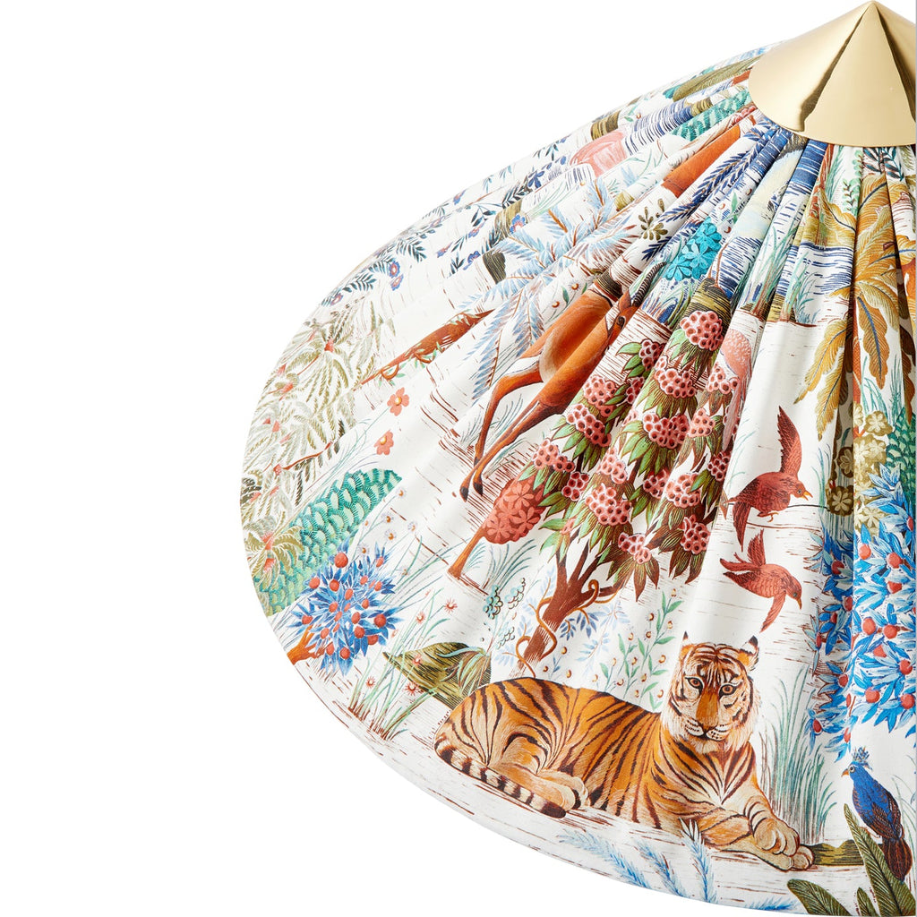 Close view of the printed shade on this Clérachic floor lamp, showing a tiger among painted trees and birds, with a brass cap.