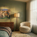Clérachic floor lamp glowing warmly in a green bedroom beside a cream swivel armchair, dresser and sheer curtains.