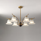 The six-light Clérachic Flora chandelier, its ribbed bell shades angled outward on brass arms.