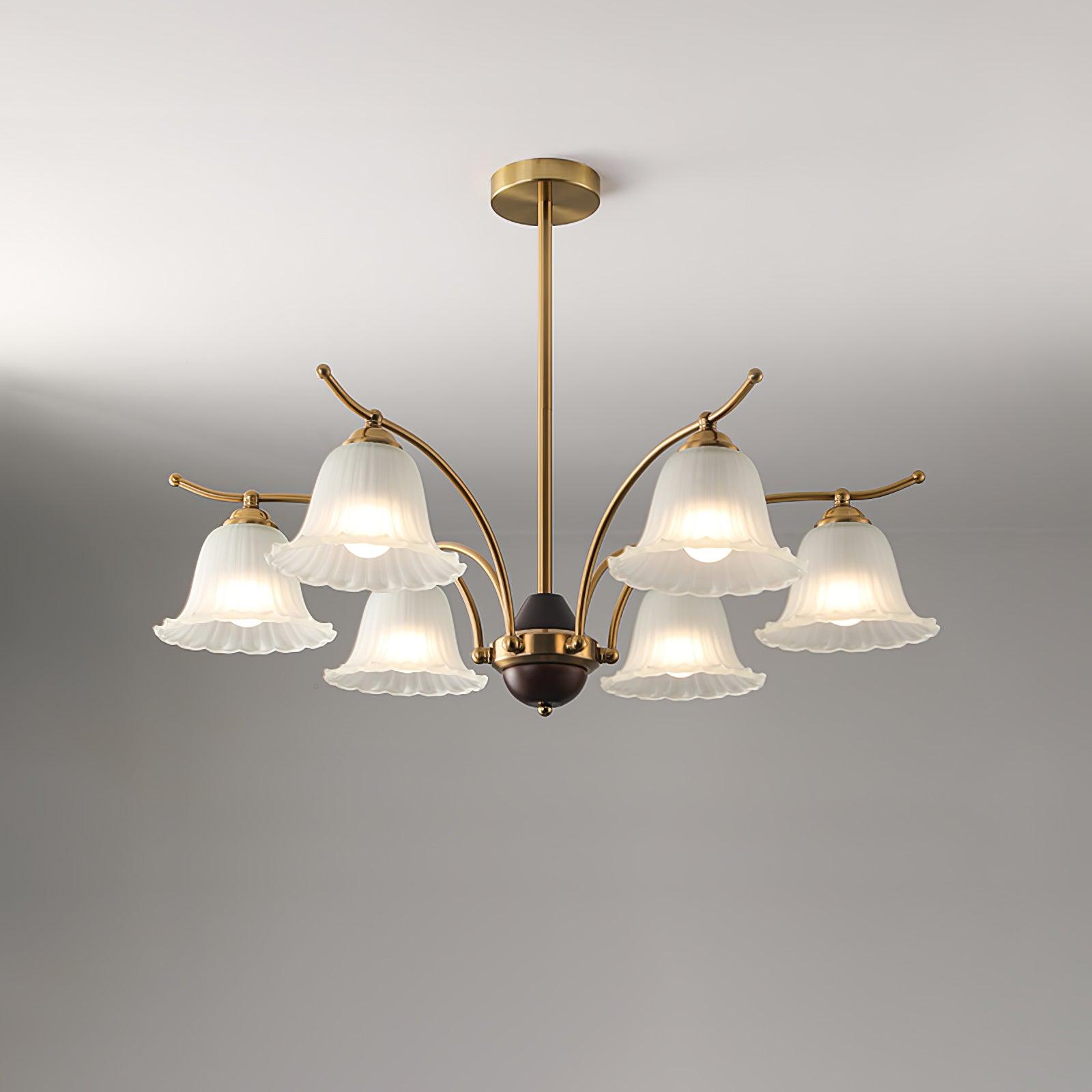 The six-light Clérachic Flora chandelier, its ribbed bell shades angled outward on brass arms.