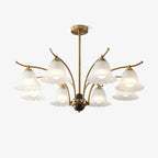 The Clérachic Flora chandelier on white, showing the brass arms and ribbed glass bell shades.