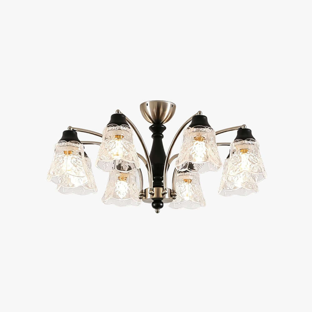 Clérachic eight-light chandelier with a black wooden column, nickel arms and floral clear-glass shades, on a plain white backdrop.