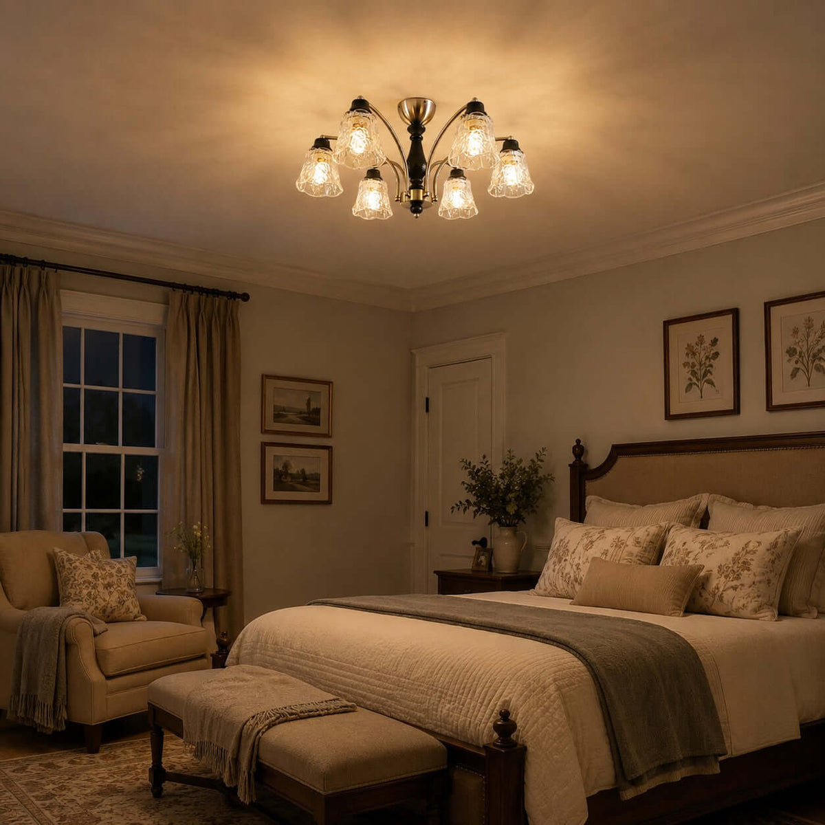 Warm-lit Clérachic chandelier in an evening bedroom with a wooden bed, a mustard armchair and framed botanical prints.