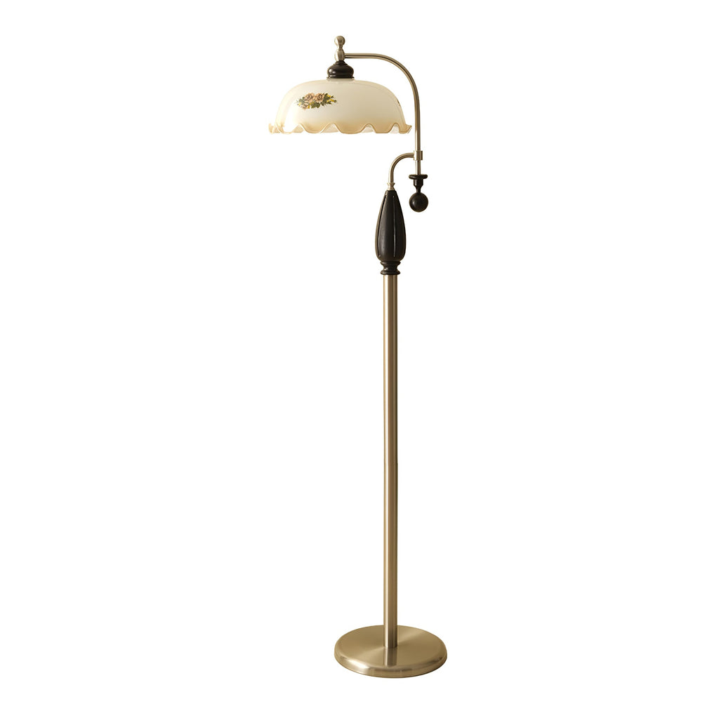 Black-and-nickel floor lamp with a frilled cream shade, photographed on a plain white backdrop; a Clérachic design.