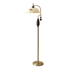 Black-and-nickel floor lamp with a frilled cream shade, photographed on a plain white backdrop; a Clérachic design.