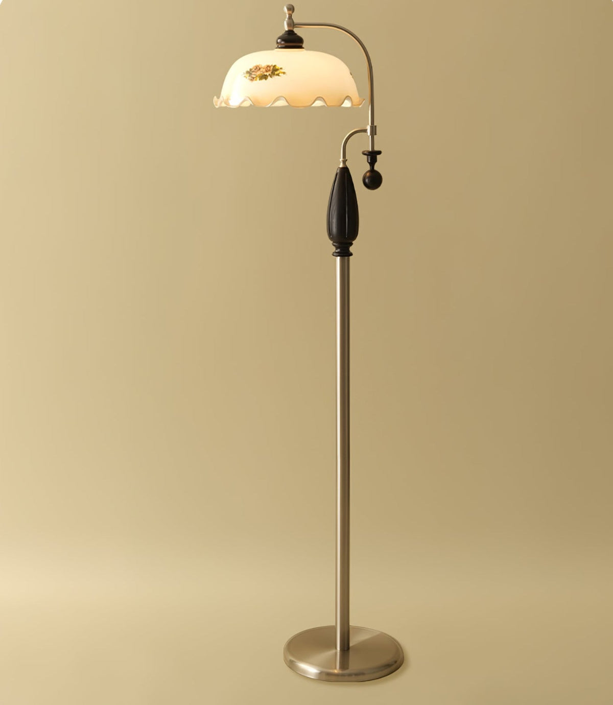 Nickel-toned version with a black wooden grip on a soft gold backdrop, shade lit and frilled; a Clérachic floor lamp.