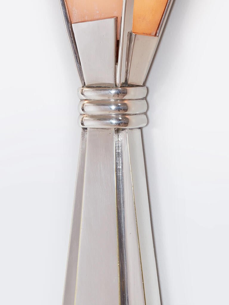 Close view of the Clérachic Florent collar, chrome bands wrapping the tapered stem.