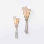 Clérachic Florent sconces in small and large, mounted together on a plain white wall.