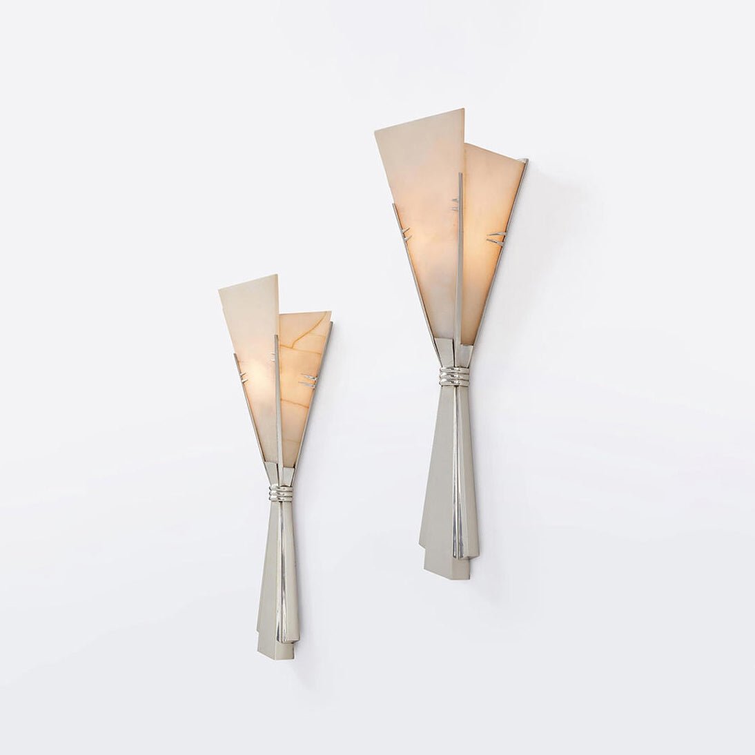 Clérachic Florent sconces in small and large, mounted together on a plain white wall.