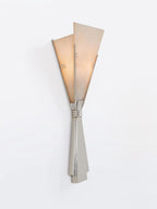 The Clérachic Florent sconce alone on white, alabaster fan lit softly from behind.