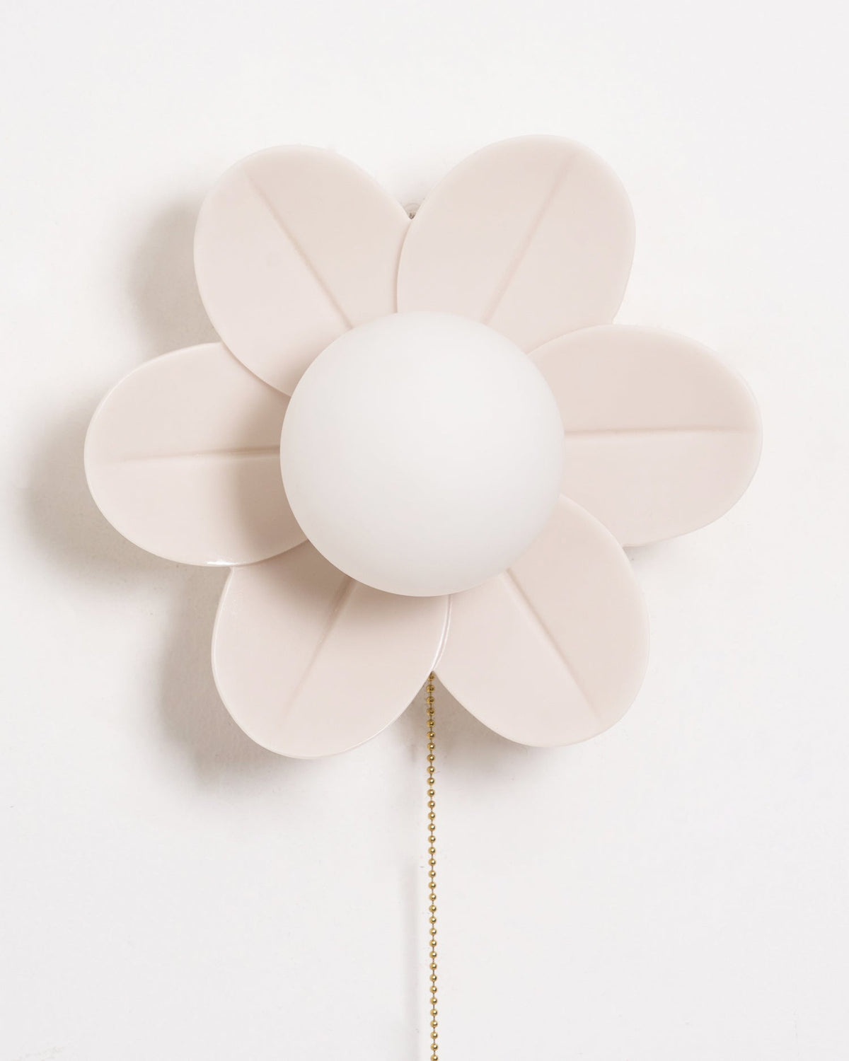 Front view of the six cream resin petals and white globe of this Clérachic flower wall light, with a gold chain falling below.
