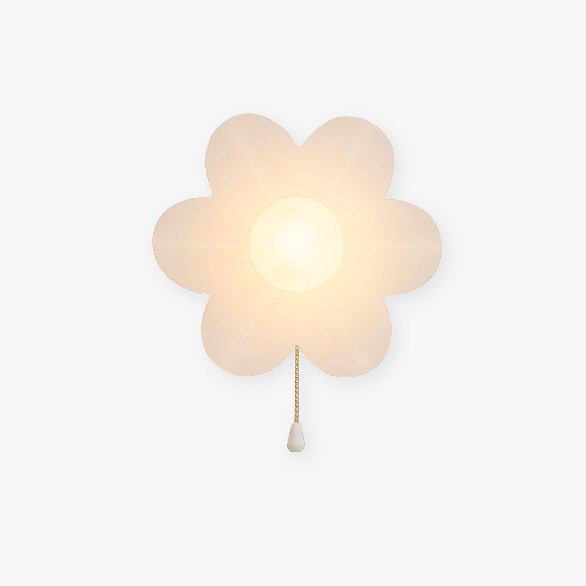 Rounded translucent-white Clérachic flower wall light lit warmly on a plain light backdrop, with a gold chain ending in a white pull.