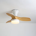 Angled view of this Clérachic ceiling fan, a white canopy and round warm-lit light under three pale wood-grain blades.