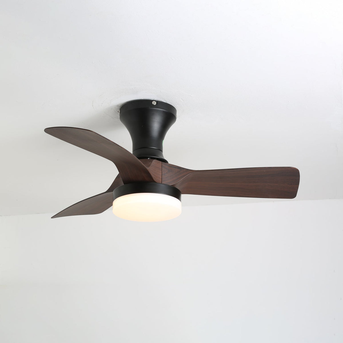 Walnut wood-grain version of this Clérachic ceiling fan with a black canopy and light ring, seen from below against a white ceiling.