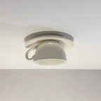 Clérachic's white ceramic coffee-cup flush mount shows the smooth glaze against gray.