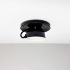 Clérachic's navy coffee-cup flush mount shows the deep glaze catching light from below.