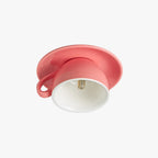 The Clérachic pink coffee-cup light reveals the LED bulb seated inside the ceramic shade.