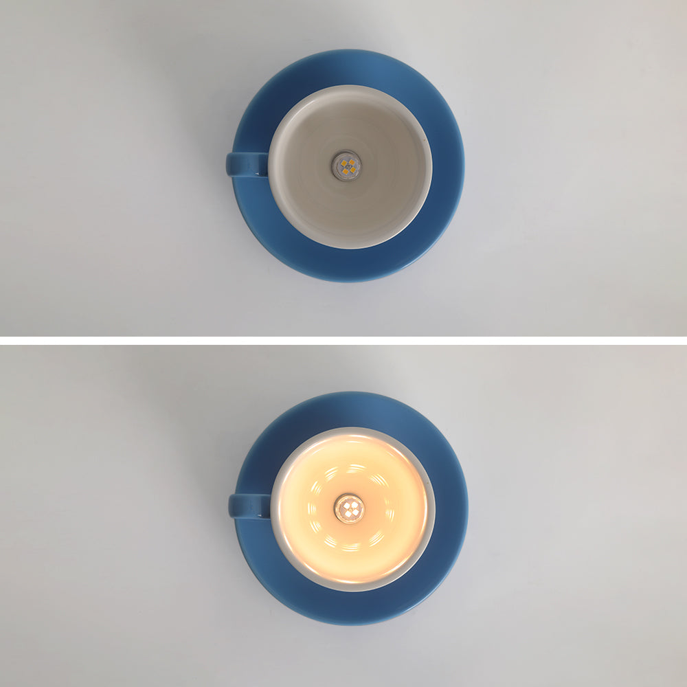 Clérachic's blue coffee-cup light is shown unlit, then glowing, in this before-and-after pair.