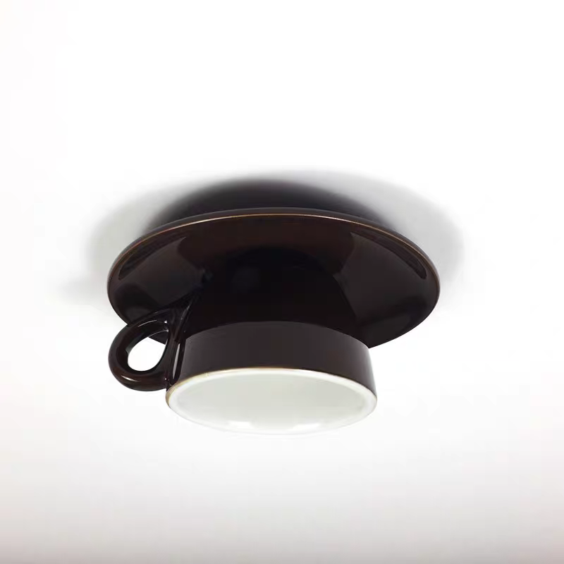 Clérachic's coffee-brown ceramic shade is shown close up, viewed straight from below.