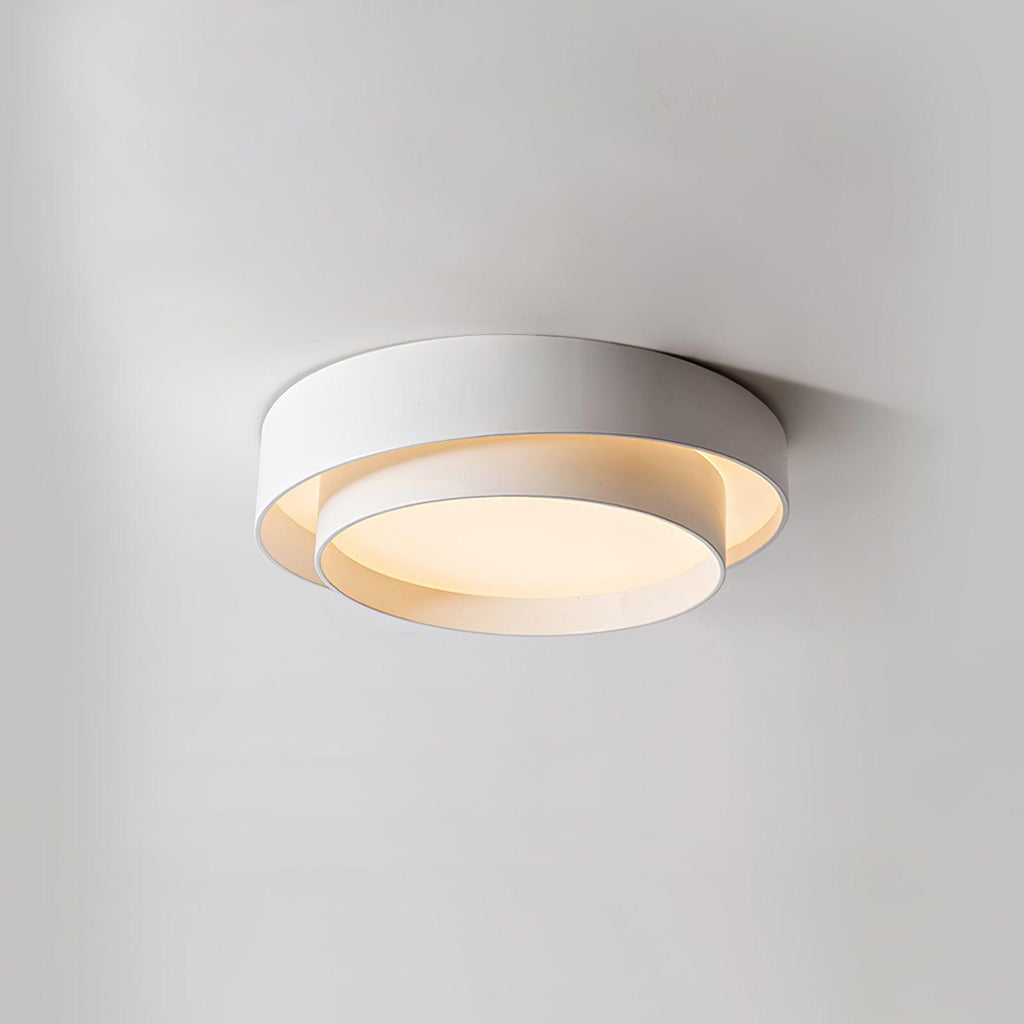 Clérachic's pale gray double-ring flush mount sits close to a plain white wall, seen side-on.