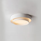 Clérachic's pale gray double-ring flush mount sits close to a plain white wall, seen side-on.