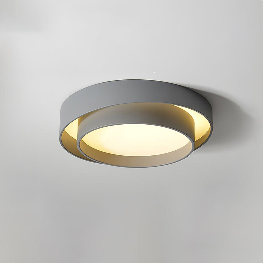 Clérachic's gray double-ring flush mount glows warm in a room with soft apricot-toned walls.
