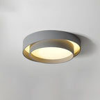 Clérachic's gray double-ring flush mount glows warm in a room with soft apricot-toned walls.