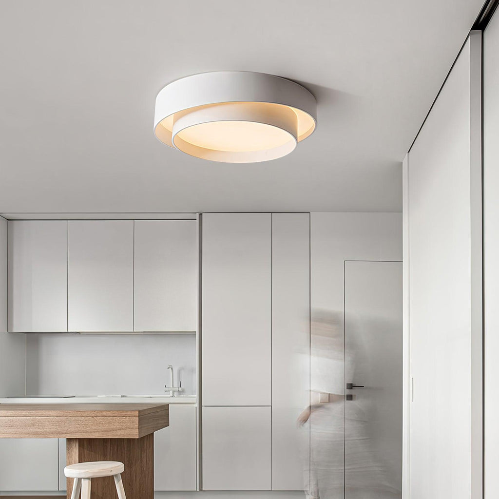 The Clérachic white double-ring ceiling light glows warm above an open kitchen counter.